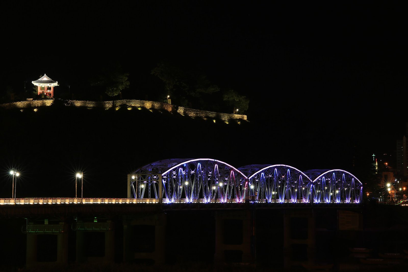 Gongsanseong Fortress and Geumgang Bridge illuminated at night in Gongju