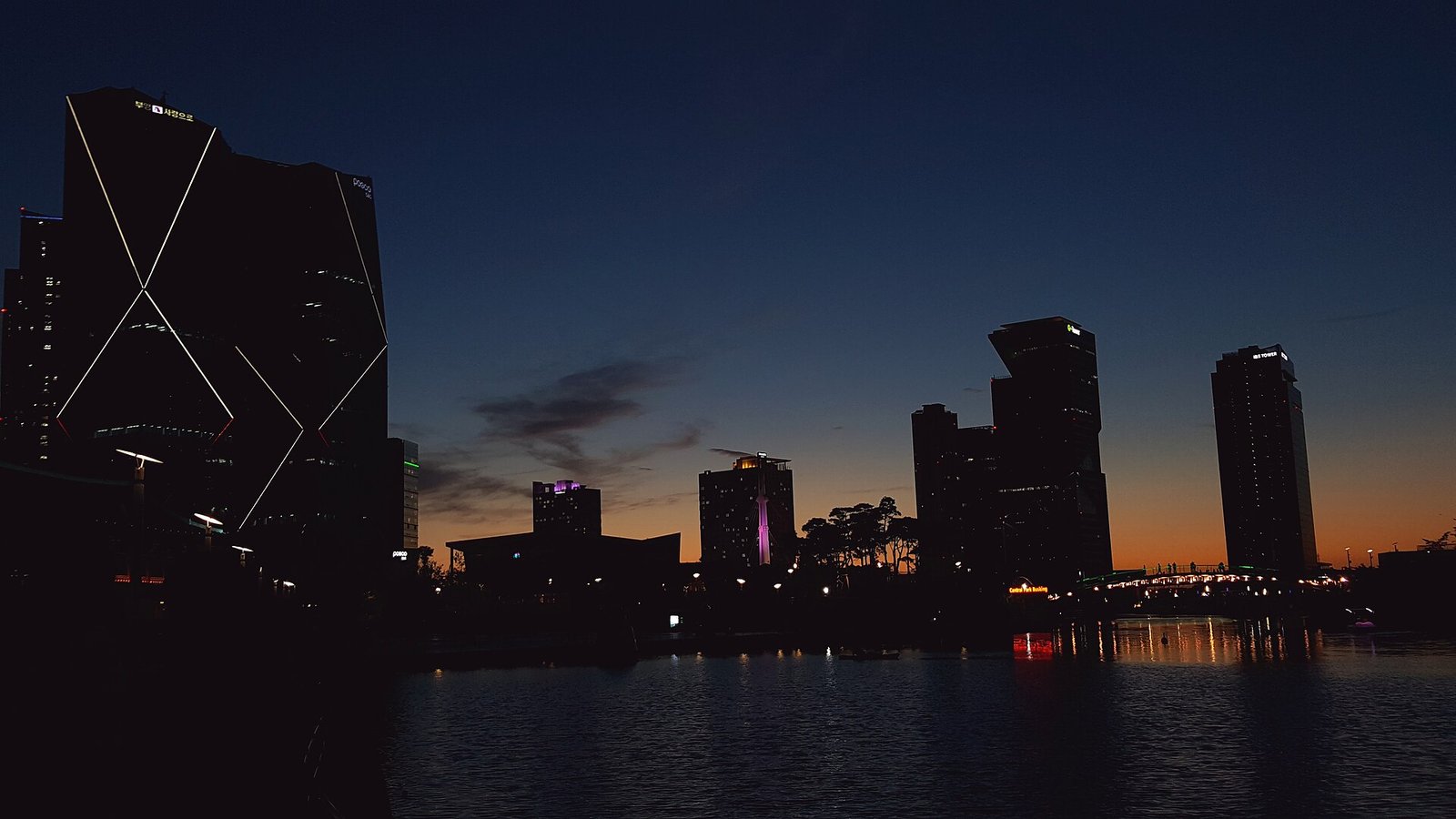 Songdo Central Park skyline and water reflections at night in Incheon
