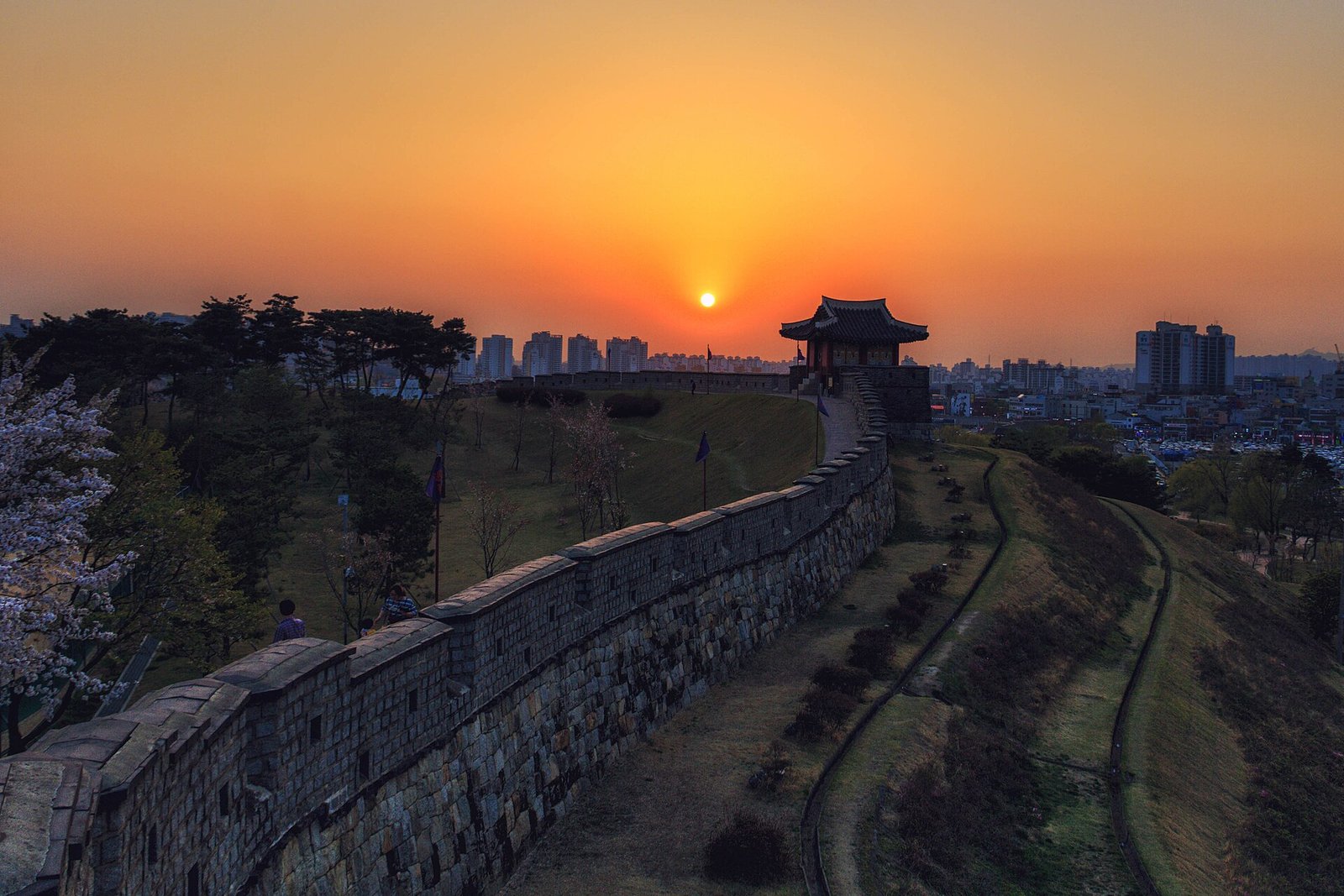 Hwaseong Fortress wall and watchtower in Suwon at sunset